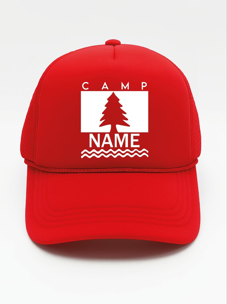 May include: A red trucker hat with a white rectangular graphic featuring a tree and the words "CAMP" and "NAME". The hat has a curved peak and mesh back.