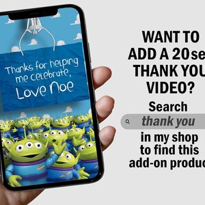 May include: A smartphone screen displaying a digital thank you card with a cartoon image of multiple green aliens from the Toy Story movie. The card says "Thanks for helping me celebrate, Love Noe". Text on the screen says "Want to add a 20 sec thank you video? Search thank you in my shop to find this add-on product."