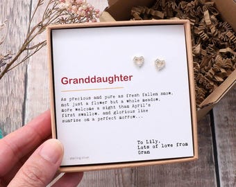May include: A small white box with a silver heart-shaped earring set inside. The box has a message that reads "Granddaughter" and a poem about the beauty of a granddaughter. The box also includes the text "To Lily, Lots of love from Gran".