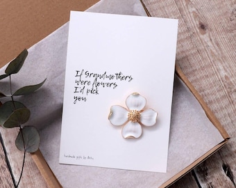 May include: A white card with the text "If grandmothers were flowers I'd pick you" and a white flower with a gold center.