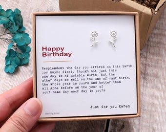 May include: A small gift box with a white card that reads "Happy Birthday". The card has a message about the importance of birthdays. The box contains a pair of sterling silver flower stud earrings.