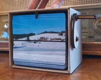 Travel memory: Memory box as photo album and flipbook picture frame for cranking