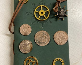 Steampunk notebook decorated with genuine old English coins. Leather binding and stamped cover. Pirate treasure notebook.