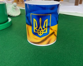 Ukrainian flag with the Trident  as background - 10oz ceramic cup - ceramic grade AAA