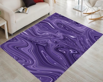 May include: A rectangular rug featuring an abstract design in shades of purple and white. The pattern resembles flowing paint, creating a dynamic aesthetic. The rug is placed on a light-coloured wooden floor. The rug's dimensions are suitable for a living room.