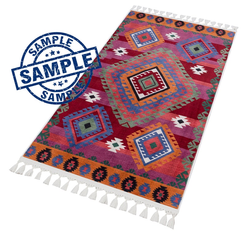 May include: A colorful rug with a geometric pattern in shades of red, orange, blue, green, and white. The rug has a fringe border.