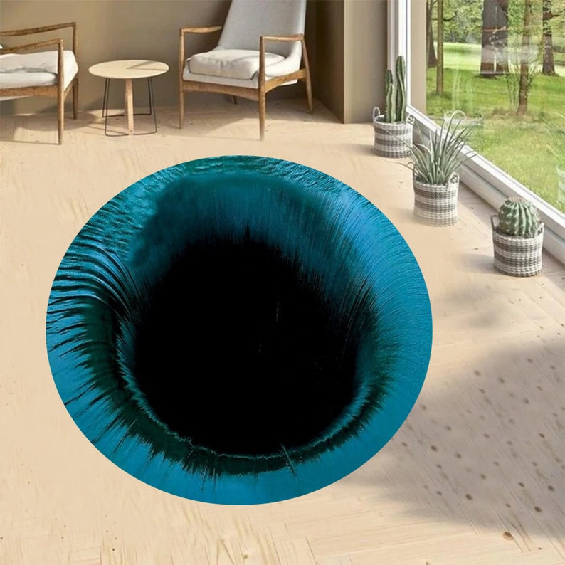 May include: A teal blue and black round rug with a swirling pattern that creates the illusion of a black hole.