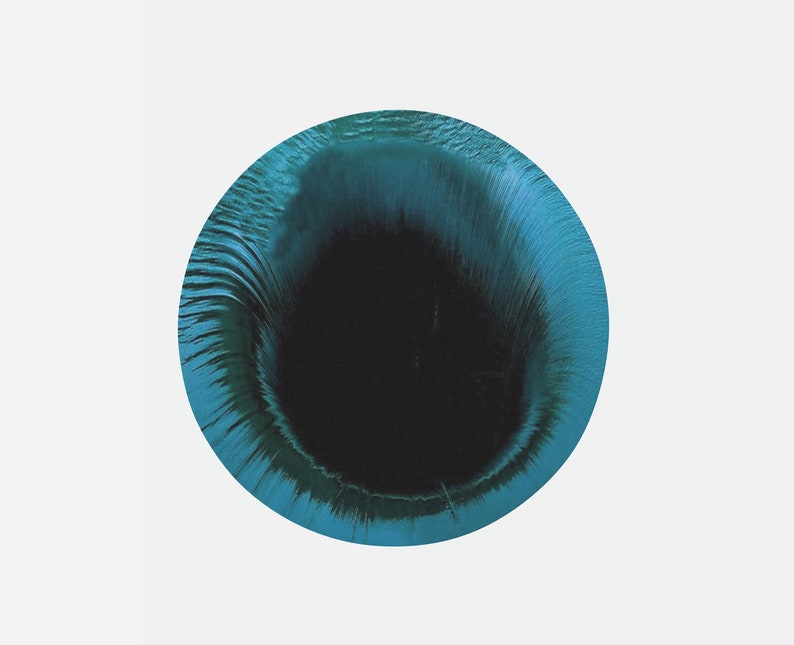 May include: A blue and black abstract circle with a swirling pattern. The center of the circle is black and the outer edge is a lighter blue.