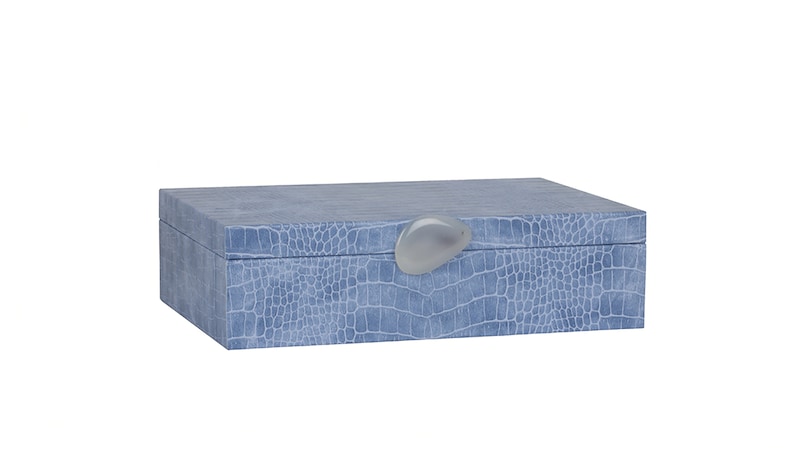 May include: A light blue rectangular box with a crocodile-embossed pattern and a white oval-shaped knob on the lid.