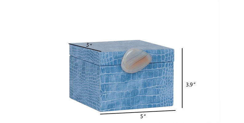 May include: A light blue square box with a crocodile-embossed pattern and a light pink agate stone lid. The box measures 5 inches by 5 inches by 3.9 inches.