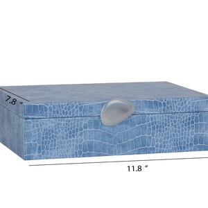 May include: A light blue rectangular jewellery box with a faux crocodile skin pattern and a white stone knob. The box measures 11.8 inches long, 7.8 inches wide, and 3.3 inches high.