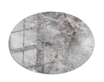 May include: Oval-shaped marble-look decorative tabletop. The surface features a gray and white veined pattern with a glossy finish. The edges are smooth and rounded. Ideal for home decor and interior design.