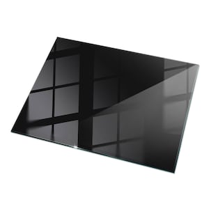 May include: A rectangular, black glass panel with a glossy finish. The surface reflects a grid-like pattern of light and shadow, suggesting a window or similar structure. The edges are clean and polished, creating a sleek, modern aesthetic.