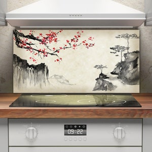 May include: A kitchen backsplash with a watercolor design of a cherry blossom tree, mountains, and a waterfall. The backsplash is installed behind a black electric stovetop with a digital timer display showing 09:22.