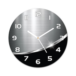May include: A round, silver and black clock with white numbers and hands. The clock has a brushed metal effect and a black section with a silver trim.