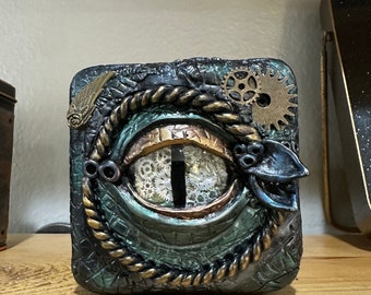 Dragon eye, upcycled Tin