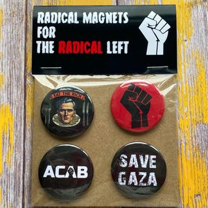May include: A set of four round magnets with political messages. The top card reads "RADICAL MAGNETS FOR THE RADICAL LEFT" with a raised fist graphic. The magnets feature phrases like "EAT THE RICH", "ACAB", and "SAVE GAZA".