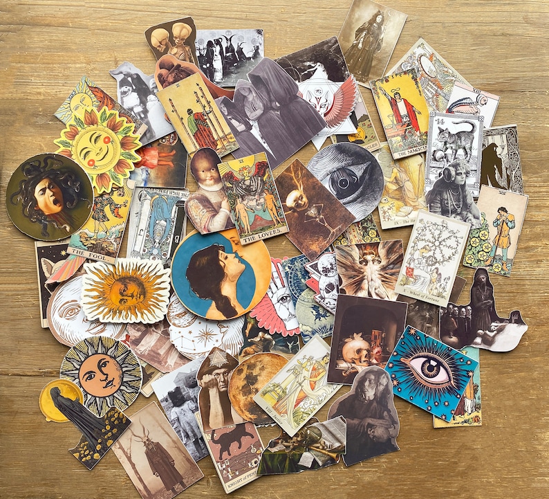 May include: A collection of colorful tarot cards featuring various illustrations, including a woman with a crown, a man with a sword, a skull, and a pair of eyes. The cards are arranged in a random pattern on a wooden surface.