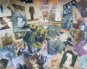May include: A collection of vintage postcards featuring a variety of images, including a headless man, a woman in a white dress, a pumpkin with a face, and a group of people in a forest. The postcards are all in black and white and have a vintage feel.