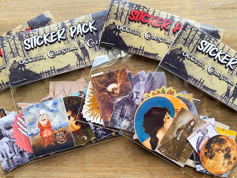 May include: A sticker pack with a variety of occult and celestial themed designs. The stickers are packaged in a clear plastic bag with a brown paper header card that reads "Sticker Pack Occult, Celestial & Cre".