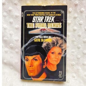 May include: A vintage paperback book titled "Star Trek: The Final Nexus" by Gene DeWeese. The cover features portraits of two characters and the Star Trek logo. The book has a black background with white and yellow text.