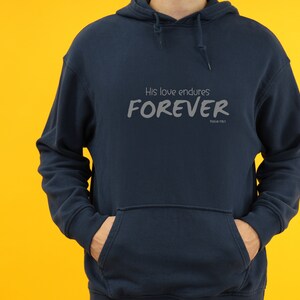 May include: Navy blue hooded sweatshirt with the text "His love endures FOREVER Psalm 136:1" printed on the front.