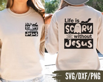 May include: A white sweatshirt with a black graphic print that says "Life is Scary without Jesus" with a ghost and bat design. The graphic is on the back of the sweatshirt. The sweatshirt is available in SVG, DXF, and PNG formats.