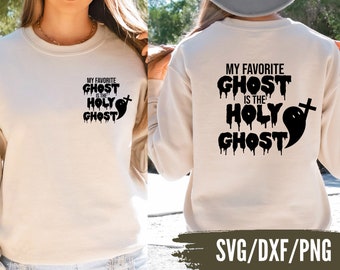 May include: A white sweatshirt with the text "My favourite ghost is the Holy Ghost" in black dripping letters and a ghost with a cross graphic. The text is on the back of the sweatshirt and the ghost graphic is on the front.