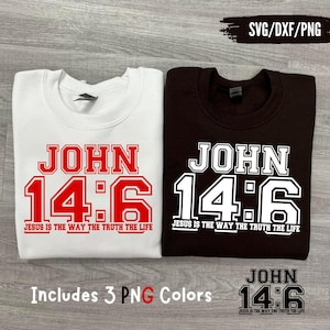 Op de afbeelding: Twee sweatshirts, één wit en één bruin, met de tekst "JOHN 14:6" in een vetgedrukte, collegiale lettertype. De zin "JESUS IS THE WAY THE TRUTH THE LIFE" staat onder de cijfers. De afbeelding bevat ook de tekst "Includes 3 PNG Colors".
