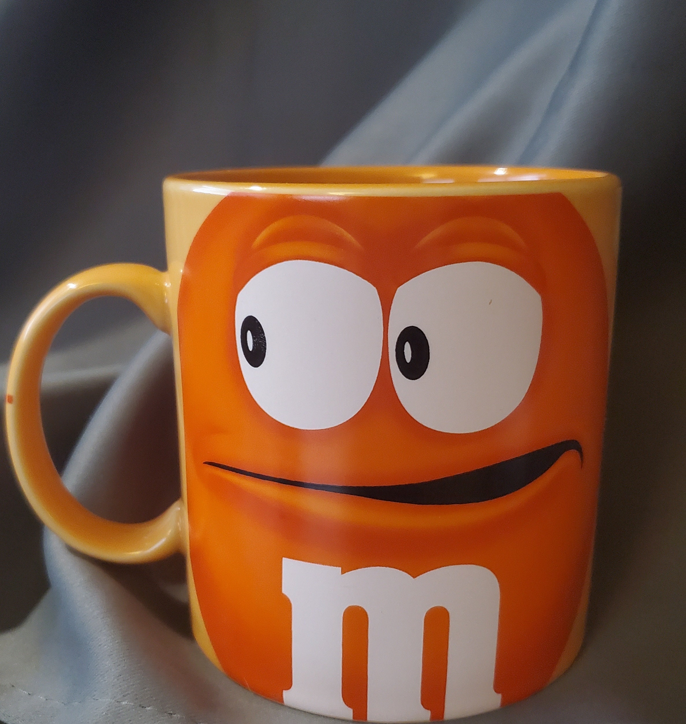 Collectible orange Crispy M&M extra large coffee mug made in Thailand