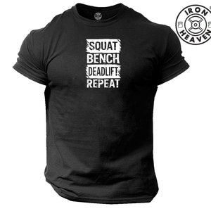 May include: Black t-shirt with a white graphic that says "SQUAT BENCH DEADLIFT REPEAT" in a distressed font.