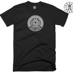 May include: Black t-shirt with a white graphic of an all-seeing eye inside a triangle with the text "Novus Ordo Seclorum" and "Annuit Coeptis".