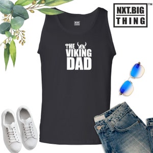 May include: Black tank top with white text that reads "The Viking Dad" with a Viking helmet and axe graphic.