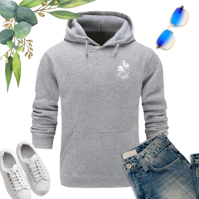 May include: A gray hooded sweatshirt with a white graphic of a flower and the word "Pelli" on the front. The sweatshirt has a kangaroo pocket and long sleeves.
