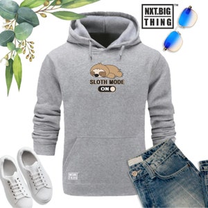 May include: Gray hooded sweatshirt with a cartoon sloth and the text "Sloth Mode On" with a toggle switch graphic.