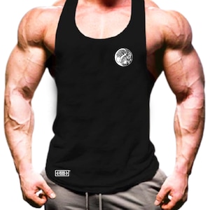 May include: Black tank top with a white circular graphic on the chest. The graphic appears to be a stylized yin and yang symbol. The tank top is sleeveless and has a rounded neckline. The bottom left corner of the tank top has a small white rectangular logo.
