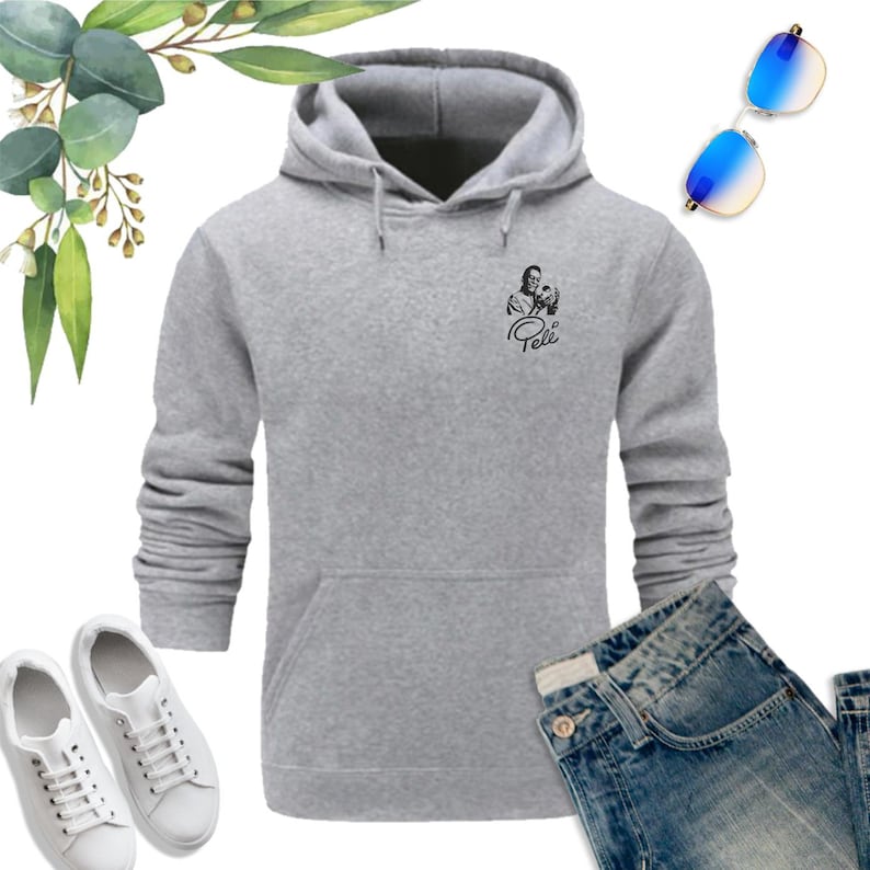 May include: A gray hooded sweatshirt with a black and white image of soccer player Pel&eacute; on the front. The text "Pel&eacute;" is printed below the image.