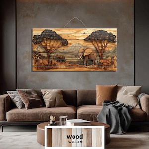 May include: Wooden wall art depicting an African savanna scene in relief. The artwork shows two elephants, trees, and a mountain range, in shades of brown and tan. The piece is displayed above a brown sofa in a living room.