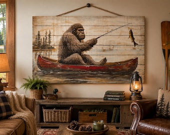 Bigfoot Fishing In Red Canoe Distressed Wood Wall Art – Sasquatch Canoe Painting Print For Cabin, Lodge, Or Lake House Rustic Decor