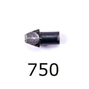 Puede incluir: Primer plano de un peque&ntilde;o objeto de metal negro con una punta puntiaguda. El objeto est&aacute; etiquetado con "750".