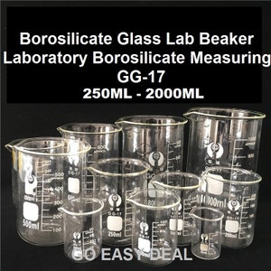 May include: A set of eight clear glass laboratory beakers with graduated markings. The beakers are labelled with the text "GG-17" and range in size from 250 ml to 1000 ml.