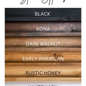 May include: Image displaying wood stain colour options. The options include Black, Kona, Dark Walnut, Early American, Rustic Honey, and Whitewash. The text "Stain Options" is written in cursive at the top of the image.