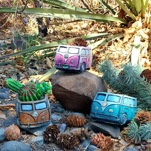 May include: A white ceramic mug with a black handle and the text "But First, Coffee" in a bold, black font. The mug is set against a neutral background, highlighting its simple design.