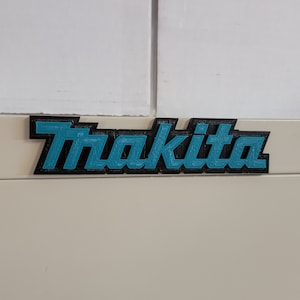 Makita Logo badge for boxes cabinets magnetic, or screw-on