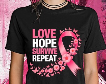 May include: Black t-shirt with the words "LOVE HOPE SURVIVE REPEAT" in pink. A pink ribbon with flowers and butterflies is featured on the front. The background is a pink and purple abstract design.
