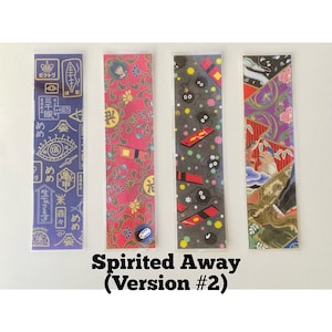 May include: Four colorful bookmarks featuring designs from the animated film "Spirited Away." The bookmarks include Japanese text and illustrations of characters and patterns. The text "Spirited Away (Version #2)" is printed at the bottom.