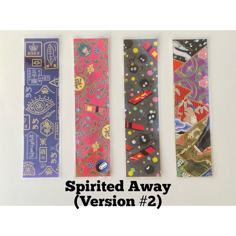 May include: Four colorful bookmarks featuring designs from the animated film "Spirited Away." The bookmarks include Japanese text and illustrations of characters and patterns. The text "Spirited Away (Version #2)" is printed at the bottom.