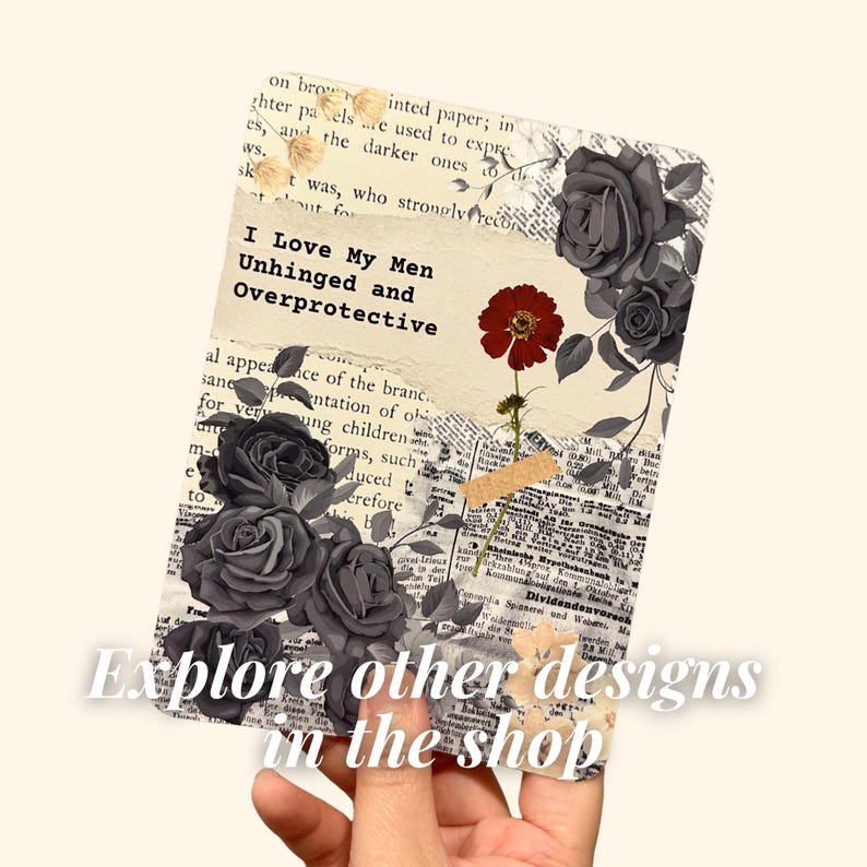 May include: A decorative card with a collage design. The card features black roses, a red flower, and text that reads "I Love My Men Unhinged and Overprotective." The card also has the text "Explore other designs in the shop."