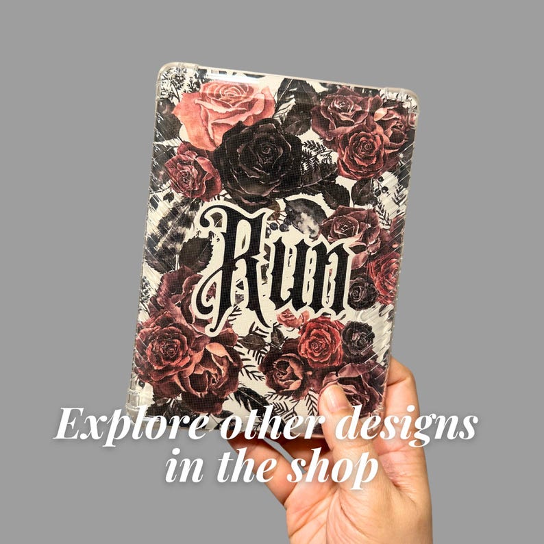 May include: A clear case with a floral design featuring red and black roses. The word "Rum" is printed in a gothic font. The text "Explore other designs in the shop" is also visible.