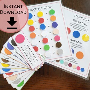 May include: A set of colour blending cards with circles of different colours. The cards are labelled with the colour names and have a plus sign and an equals sign. The cards are designed to help children learn about colour mixing.
